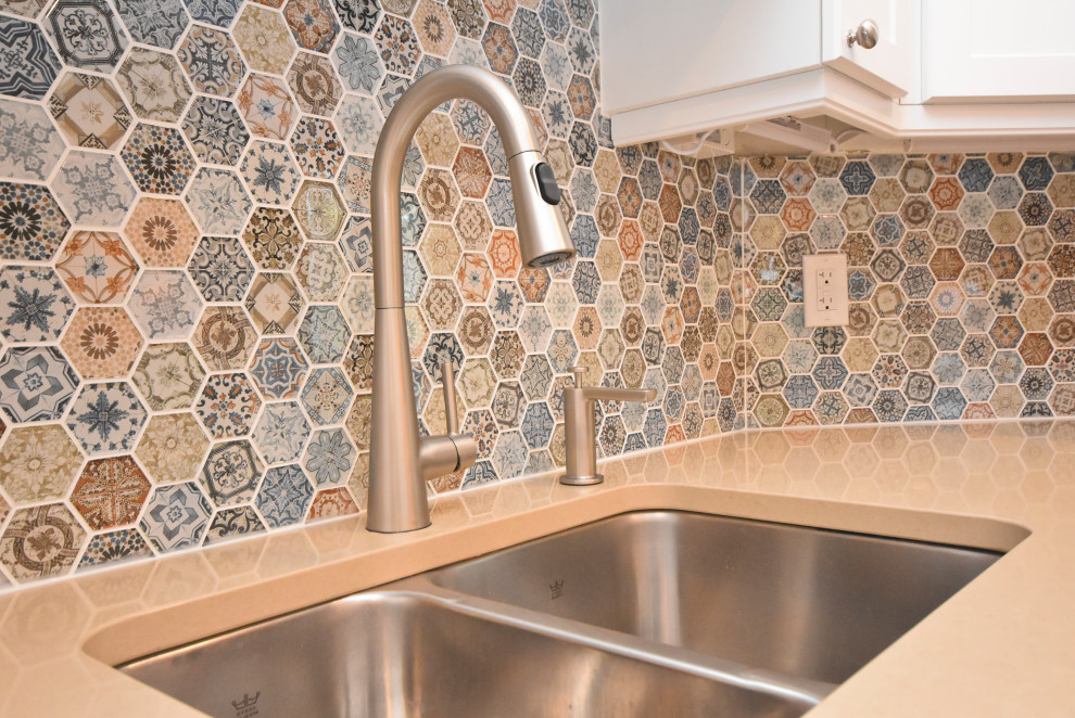 Mid-sized transitional l-shaped vinyl floor and beige floor kitchen photo in Ottawa with a double-bowl sink, shaker cabinets, white cabinets, quartzite countertops, multicolored backsplash, mosaic tile backsplash, stainless steel appliances, an island and beige countertops
