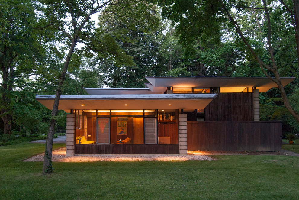 Design ideas for a midcentury exterior in Philadelphia with wood siding.