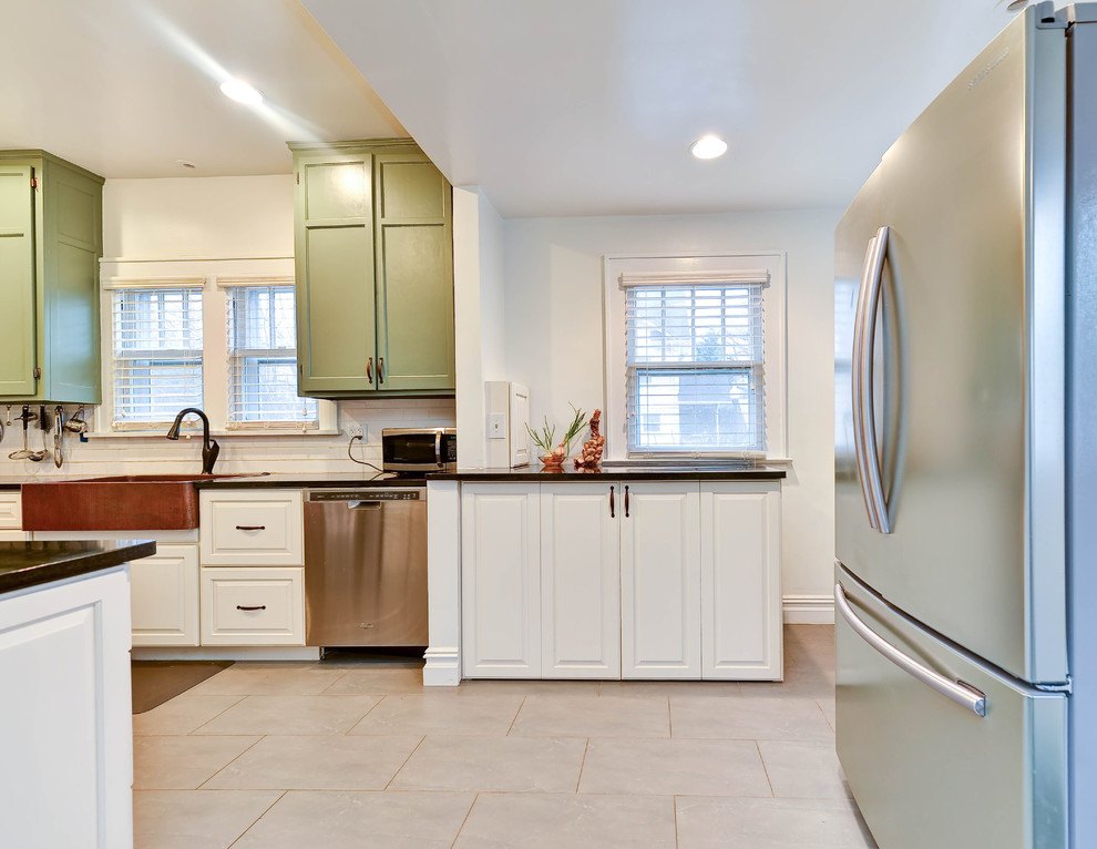 This is an example of a mid-sized country galley utility room with white cabinets, quartz benchtops, white walls, ceramic floors, a side-by-side washer and dryer and raised-panel cabinets.