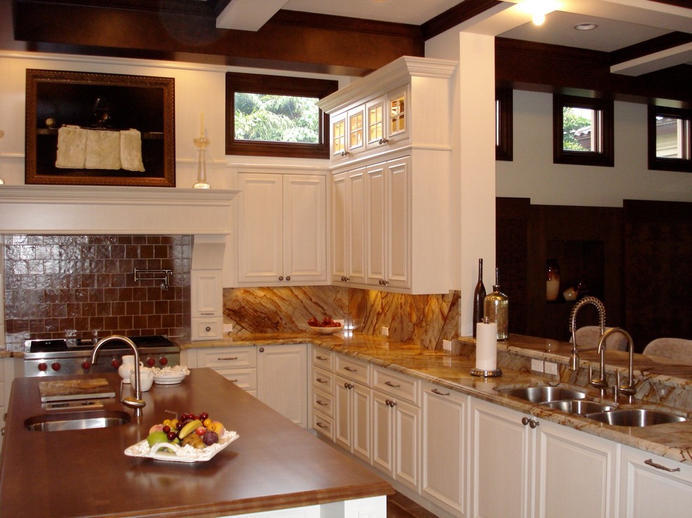 Large transitional u-shaped limestone floor open concept kitchen photo in Miami with an undermount sink, raised-panel cabinets, white cabinets, onyx countertops, multicolored backsplash, paneled appliances and an island
