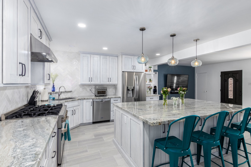 Inspiration for a transitional l-shaped kitchen remodel in Phoenix with a single-bowl sink, shaker cabinets, white cabinets, granite countertops, white backsplash and stainless steel appliances