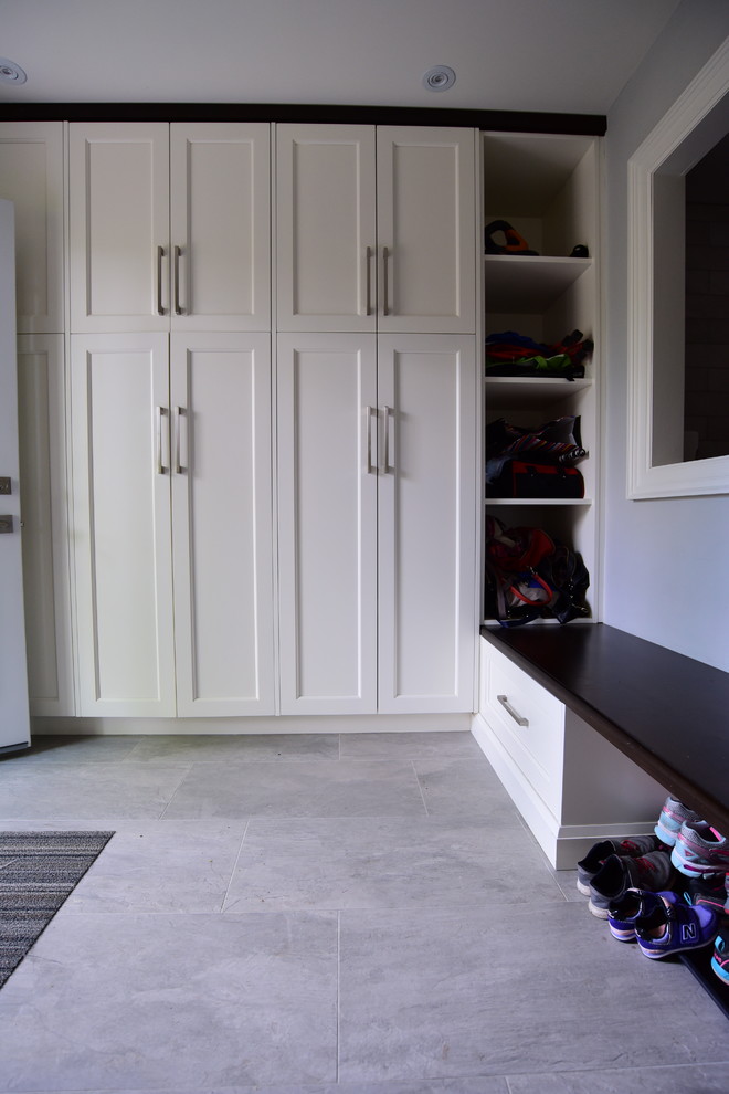 Inspiration for a porcelain tile and gray floor entryway remodel in Toronto