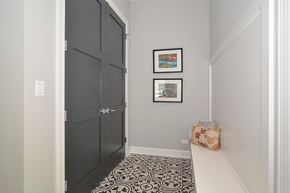 Mudroom - mid-sized transitional ceramic tile and multicolored floor mudroom idea in Chicago with gray walls