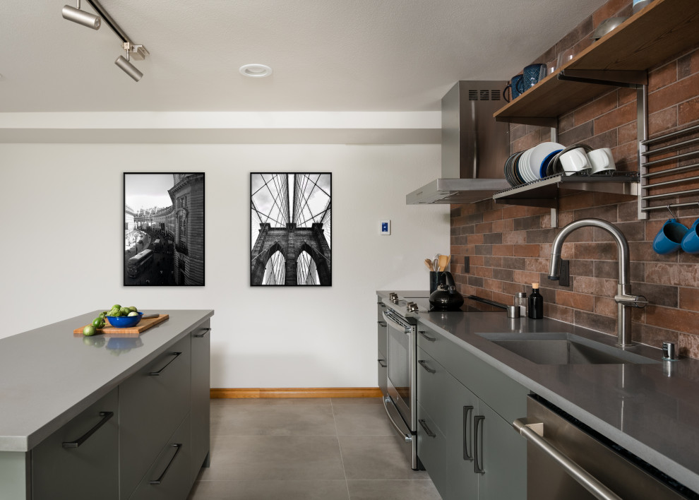 Example of a small minimalist single-wall porcelain tile and gray floor open concept kitchen design in Seattle with an undermount sink, flat-panel cabinets, gray cabinets, quartz countertops, brown backsplash, porcelain backsplash, stainless steel appliances, an island and gray countertops