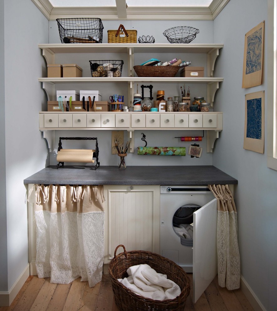 Design ideas for a country laundry room in Boston with beige cabinets, blue walls and medium hardwood floors.