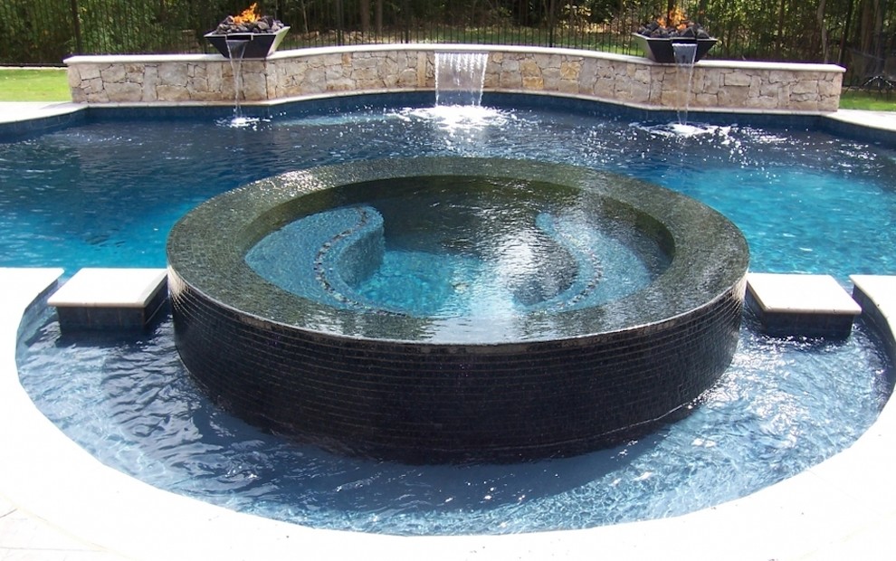 Photo of a traditional backyard pool in Dallas with a hot tub.