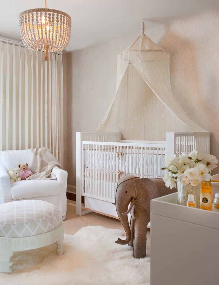 Photo of a transitional gender-neutral nursery in San Diego with beige walls and wallpaper.
