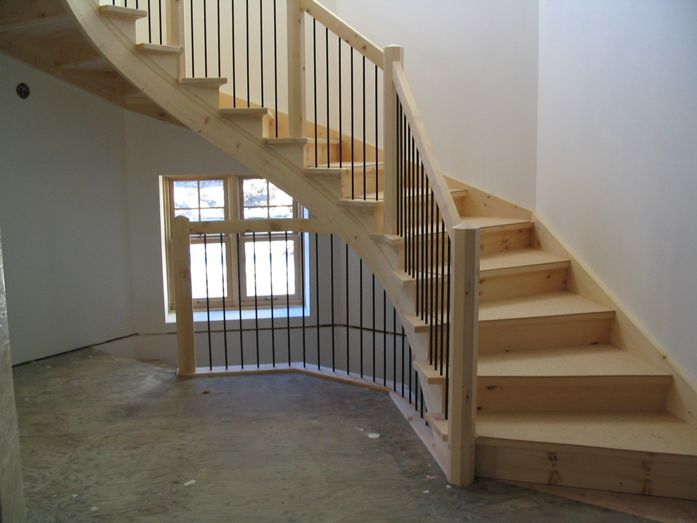 Inspiration for a huge rustic wooden curved staircase remodel with wooden risers