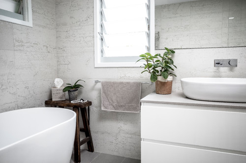 modern coastal bathroom corner styled with plant