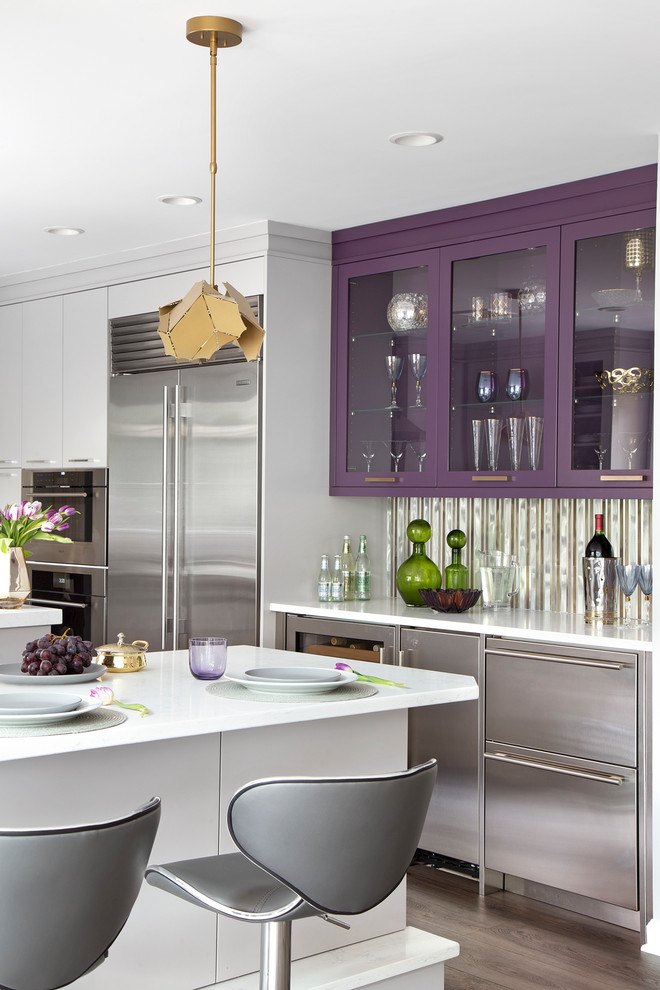 Inspiration for a mid-sized contemporary kitchen in New York with a triple-bowl sink, flat-panel cabinets, purple cabinets, quartz benchtops, metallic splashback, mirror splashback, stainless steel appliances, vinyl floors, with island, grey floor and white benchtop.