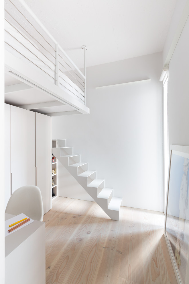 Inspiration for a scandinavian straight staircase in London with open risers.