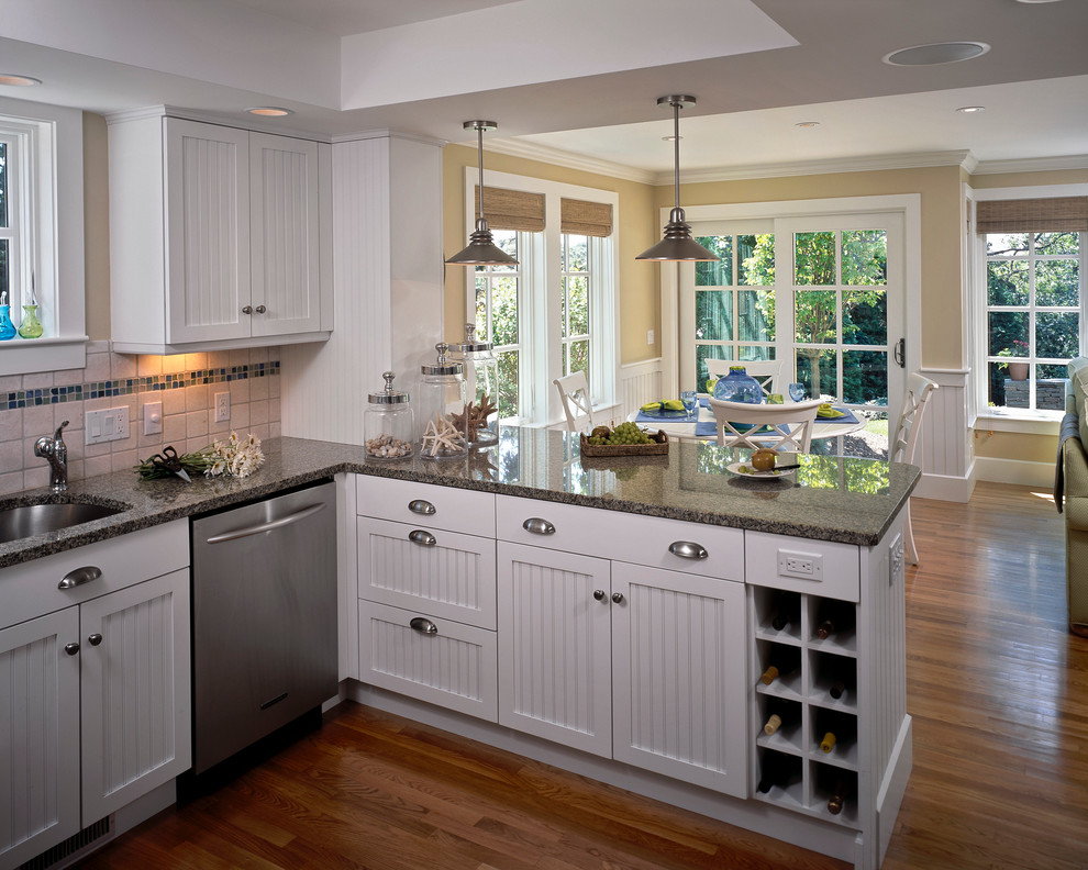 Inspiration for a traditional eat-in kitchen in Boston with an undermount sink, recessed-panel cabinets, white cabinets, multi-coloured splashback and stainless steel appliances.