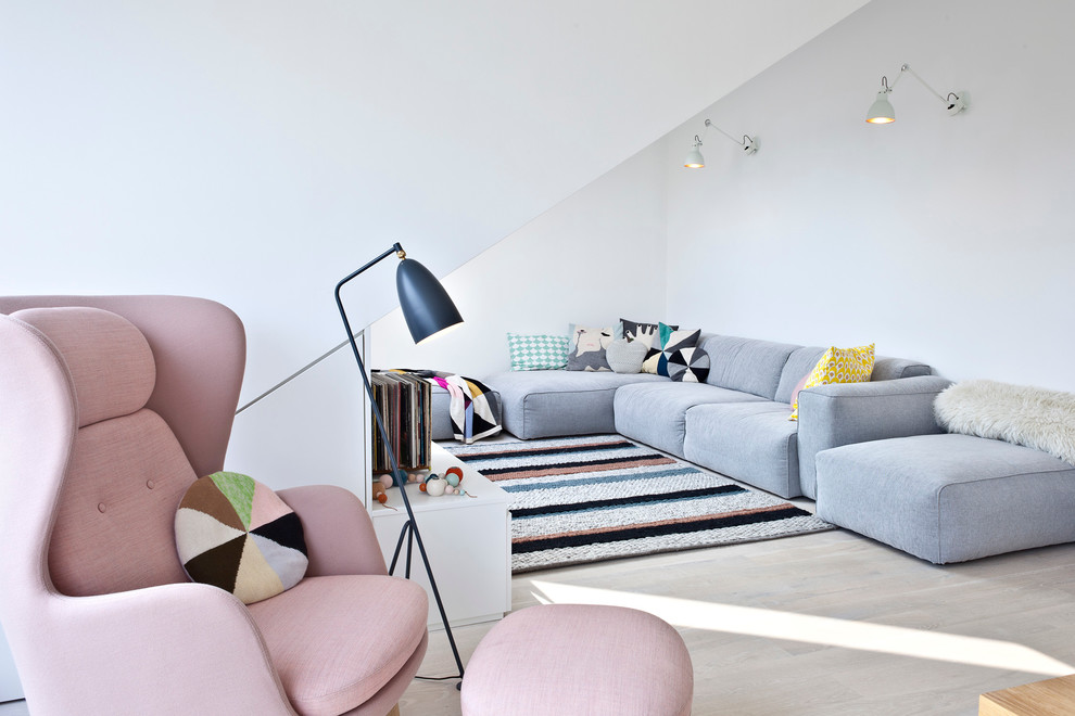 Living room - scandinavian formal light wood floor living room idea with white walls