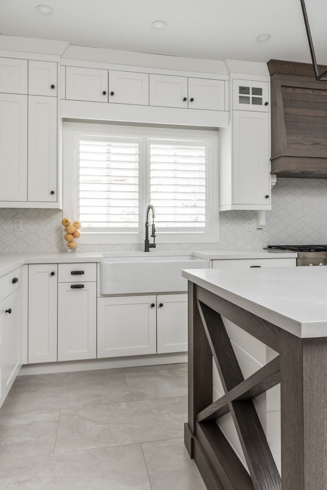 Example of a transitional kitchen design in Toronto