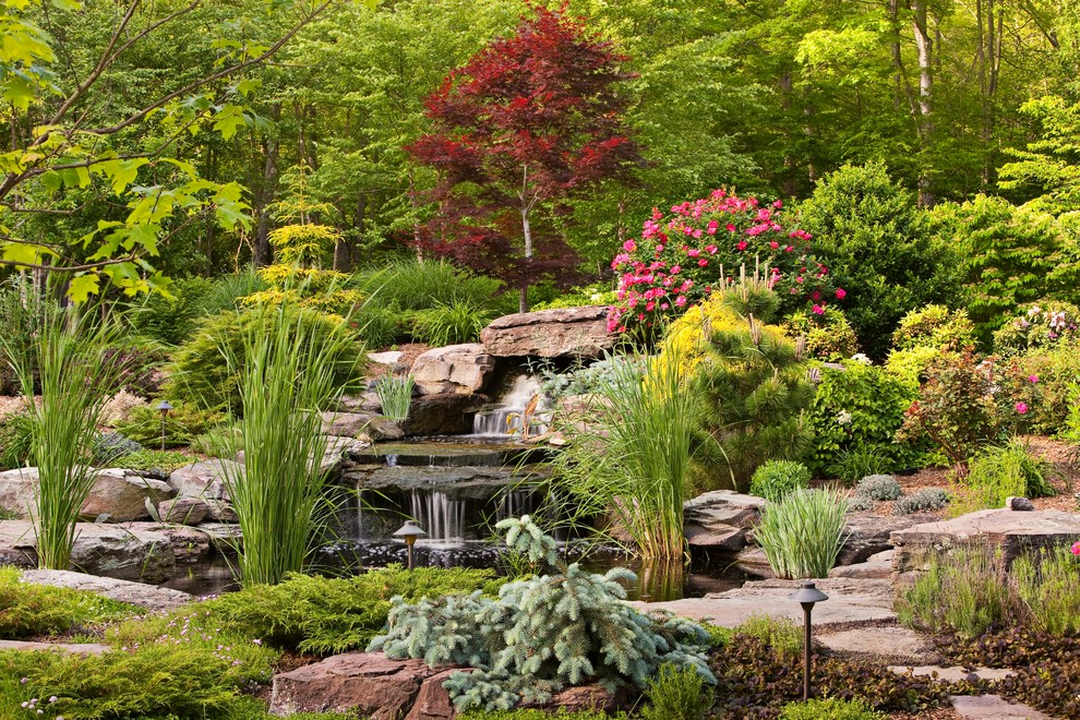 Traditional garden in New York with a water feature.