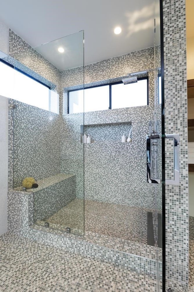 Mid-sized modern master bathroom in Los Angeles with flat-panel cabinets, medium wood cabinets, a freestanding tub, an alcove shower, multi-coloured tile, mosaic tile, beige walls, mosaic tile floors and an integrated sink.