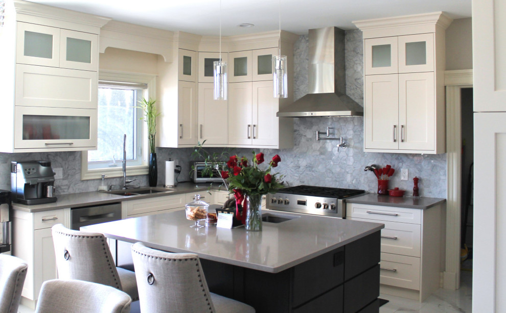 Inspiration for a large transitional u-shaped eat-in kitchen remodel with shaker cabinets, white cabinets, quartz countertops, gray backsplash, stainless steel appliances, an island and gray countertops