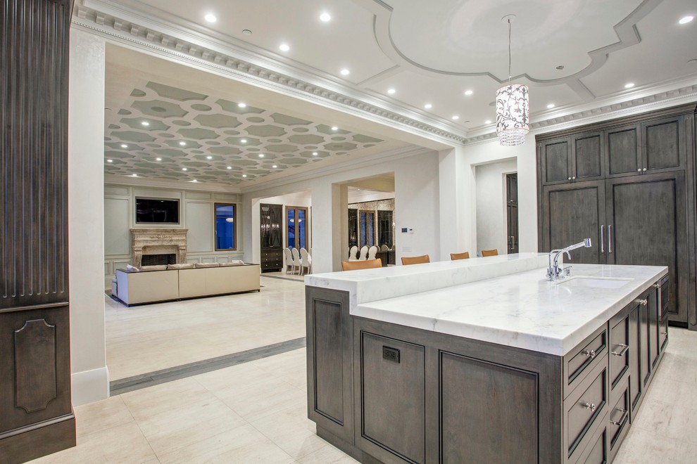 Example of a large transitional l-shaped open concept kitchen design in Orange County with a single-bowl sink, gray cabinets, marble countertops, multicolored backsplash, paneled appliances and an island