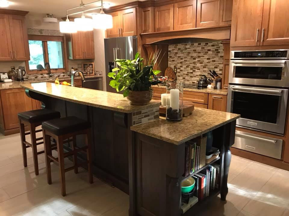 This is an example of a large eclectic eat-in kitchen in Other with a triple-bowl sink, flat-panel cabinets, medium wood cabinets, quartz benchtops and with island.