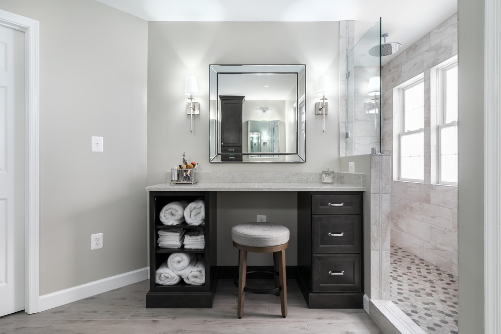 Inspiration for a large transitional master beige tile and porcelain tile porcelain tile and gray floor doorless shower remodel in DC Metro with recessed-panel cabinets, black cabinets, a two-piece toilet, beige walls, an undermount sink, granite countertops and beige countertops