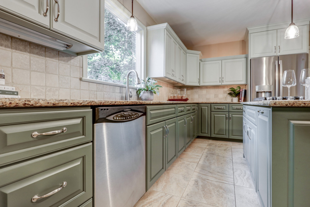 Eat-in kitchen - mid-sized transitional l-shaped ceramic tile and beige floor eat-in kitchen idea with a double-bowl sink, raised-panel cabinets, green cabinets, granite countertops, beige backsplash, ceramic backsplash, stainless steel appliances, an island and beige countertops
