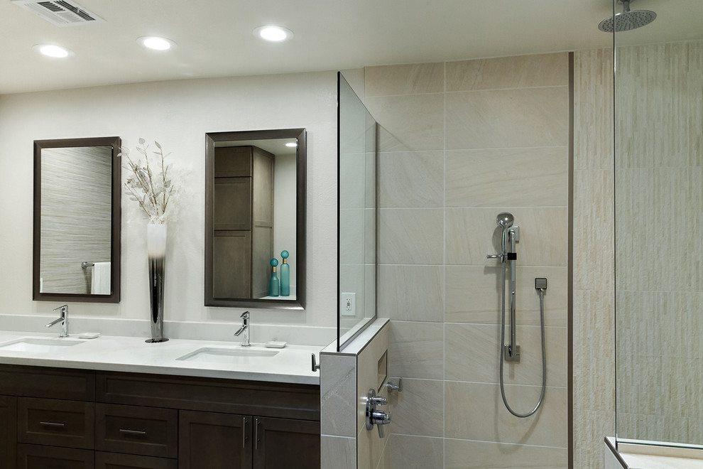 Inspiration for a mid-sized transitional master bathroom in Phoenix with shaker cabinets, grey cabinets, a corner shower, a one-piece toilet, white tile, porcelain tile, grey walls, porcelain floors, an undermount sink, engineered quartz benchtops, grey floor, an open shower and white benchtops.