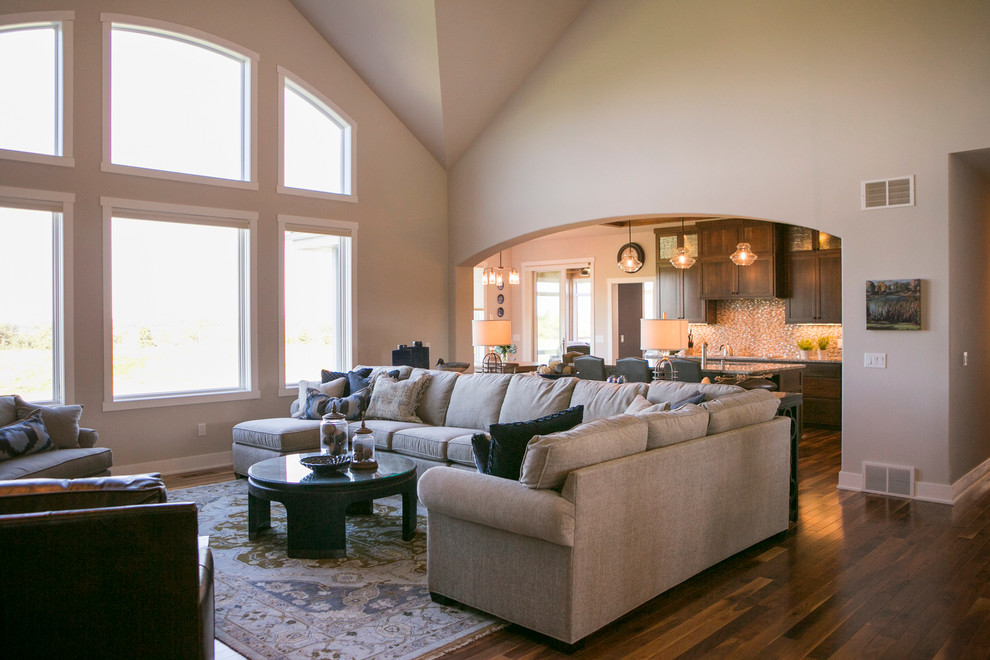 Transitional dark wood floor and brown floor open concept kitchen photo with recessed-panel cabinets, dark wood cabinets, granite countertops, beige backsplash, glass sheet backsplash and an island