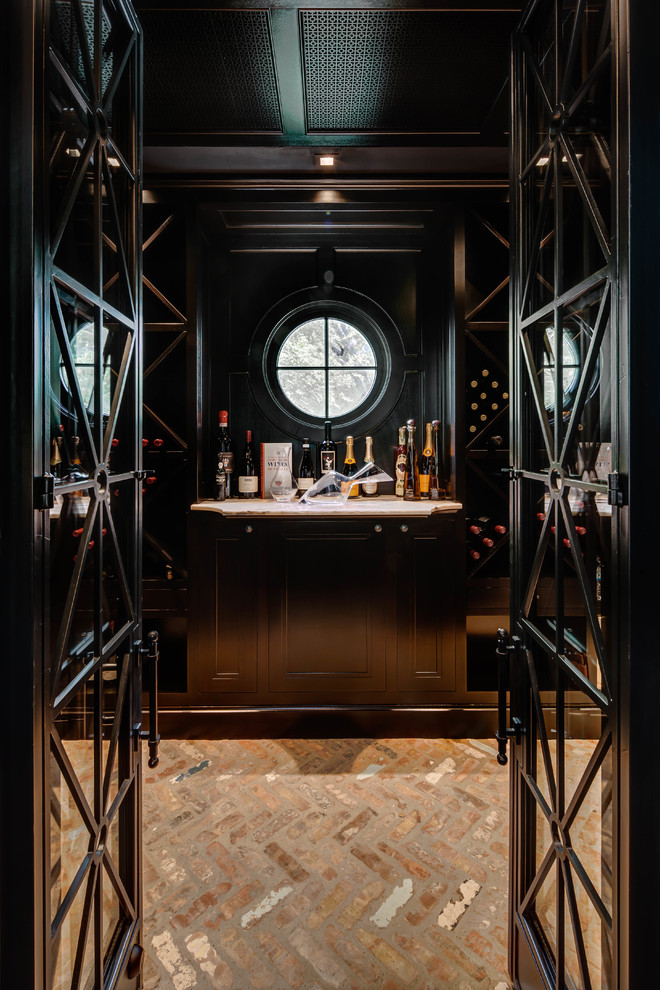 Inspiration for a transitional wine cellar in Houston with storage racks.