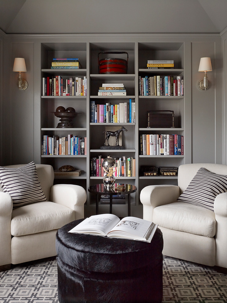 Photo of a large transitional enclosed family room in San Francisco with a library, grey walls, carpet and no tv.