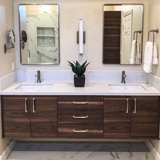 Example of a mid-century modern porcelain tile, multicolored floor and double-sink bathroom design in Orange County with flat-panel cabinets, medium tone wood cabinets, an undermount sink, quartz countertops and a floating vanity