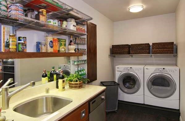 Inspiration for a mid-sized eclectic l-shaped dark wood floor utility room remodel in San Diego with an undermount sink, shaker cabinets, medium tone wood cabinets, marble countertops and a side-by-side washer/dryer