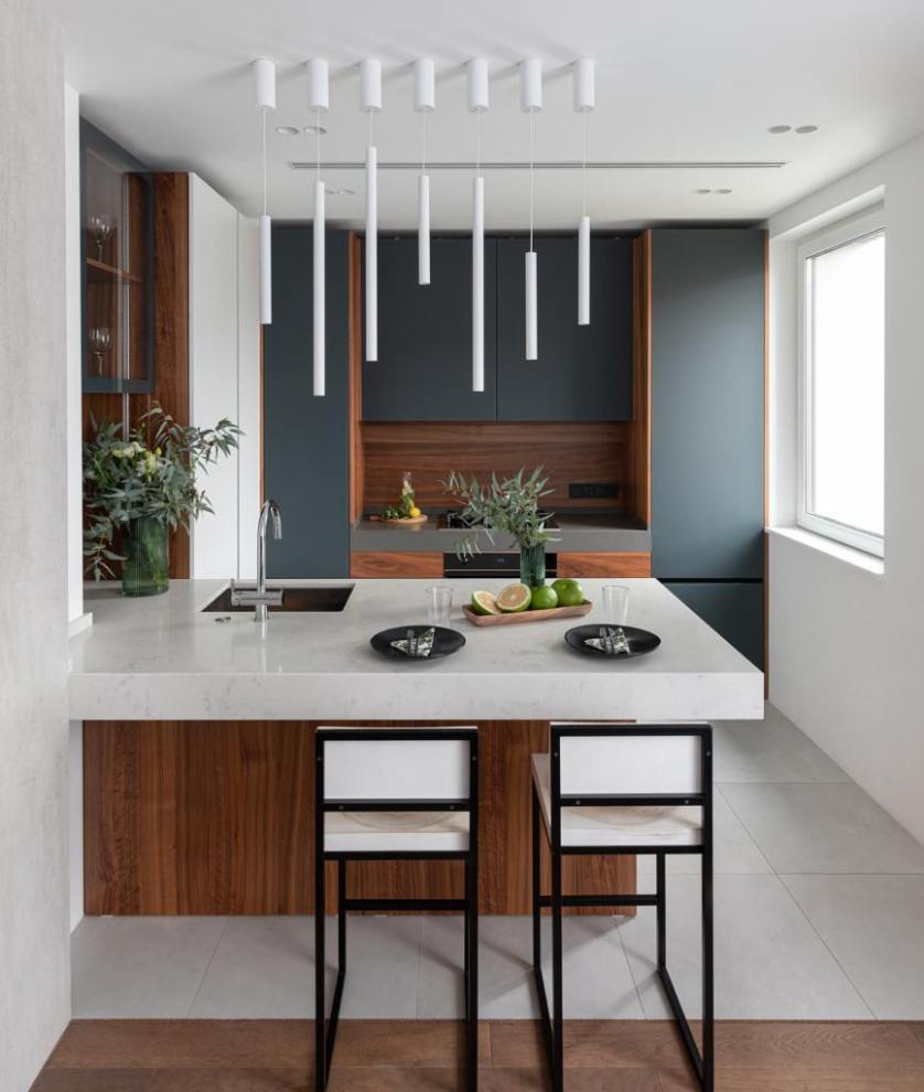 Inspiration for a mid-sized contemporary u-shaped separate kitchen in Other with flat-panel cabinets, quartz benchtops, grey benchtop, an undermount sink, medium wood cabinets, brown splashback, timber splashback, porcelain floors, a peninsula and grey floor.