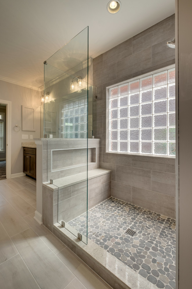 Design ideas for a large contemporary master bathroom in Nashville with shaker cabinets, dark wood cabinets, a two-piece toilet, gray tile, porcelain tile, grey walls, plywood floors, an undermount sink, engineered quartz benchtops, white floor, an open shower and grey benchtops.