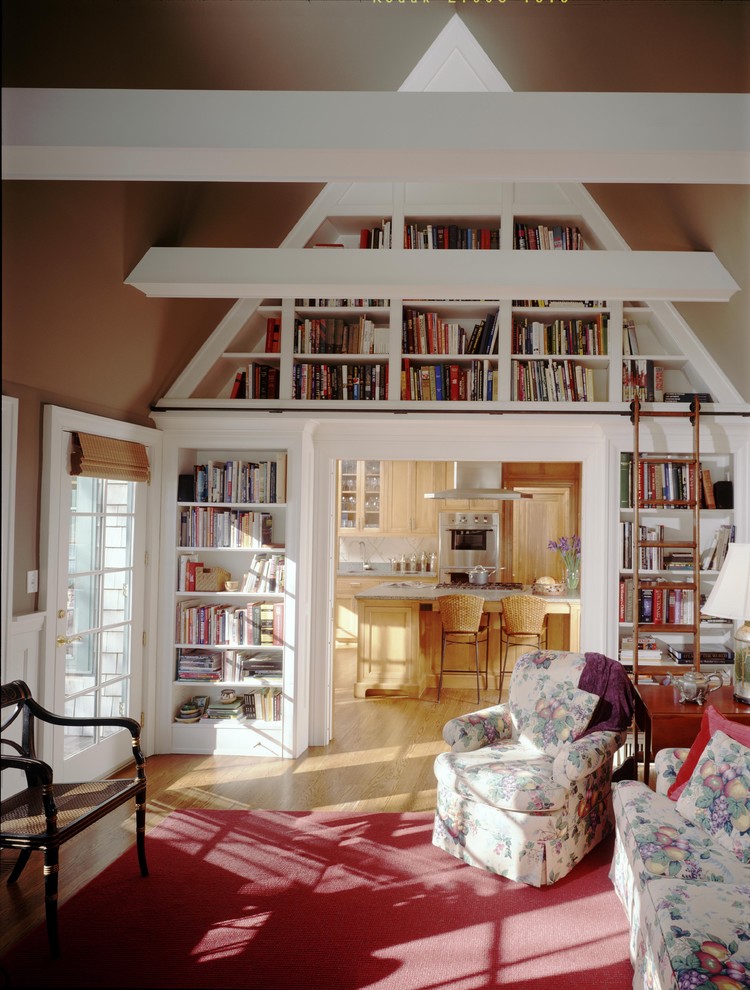 Traditional enclosed living room in Minneapolis with a library and brown walls.