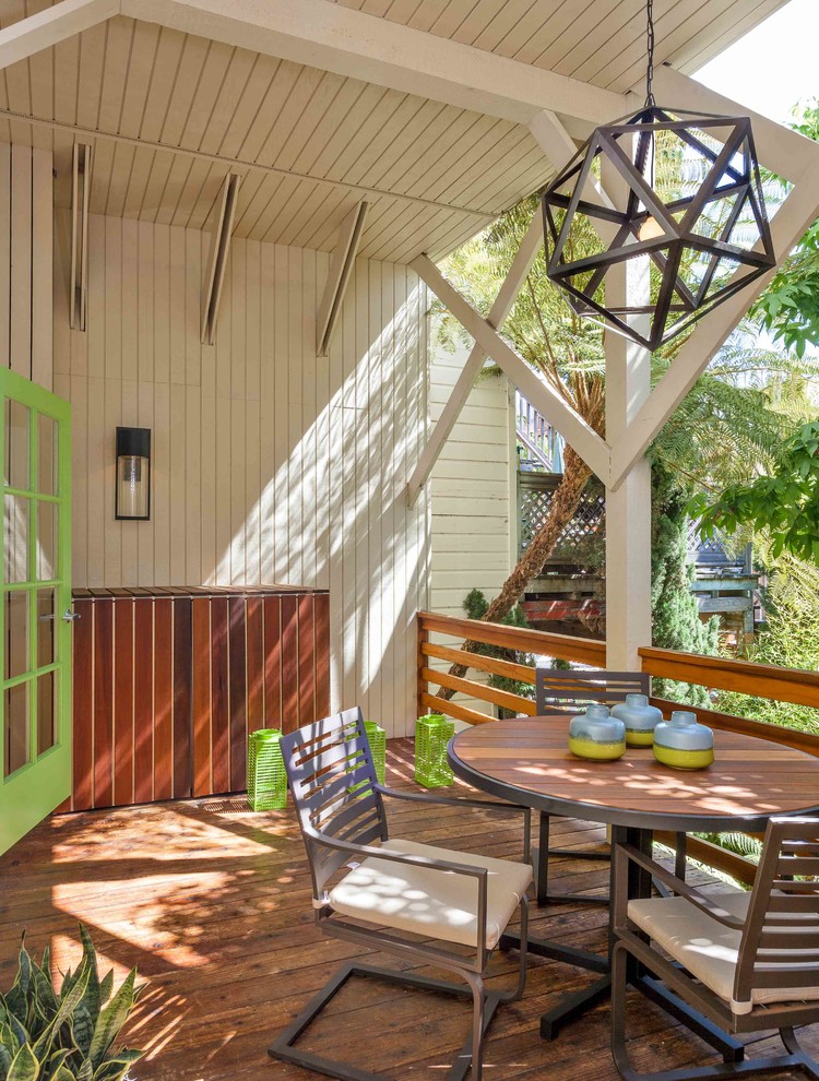 Transitional backyard deck photo in Los Angeles with decking and a roof extension
