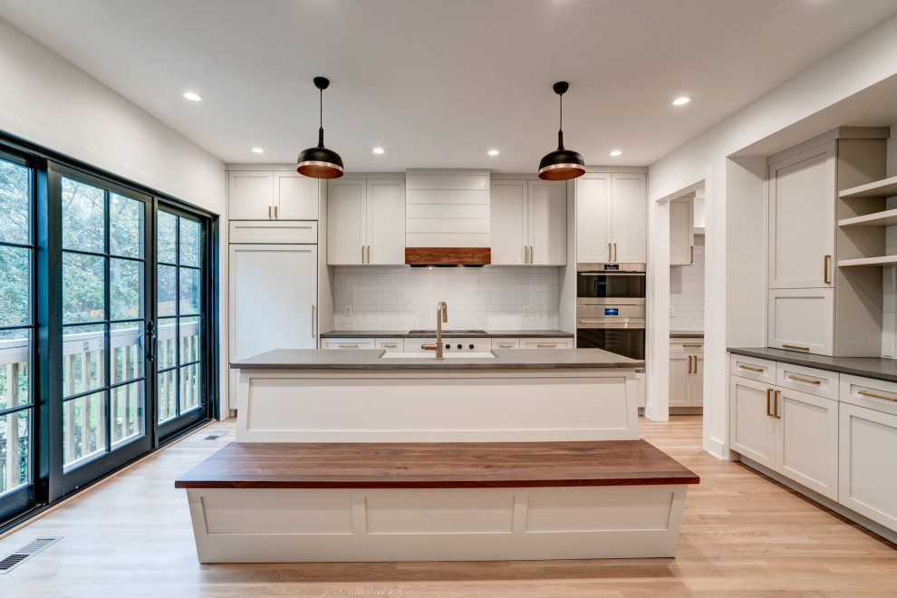 This is an example of a mid-sized contemporary kitchen in DC Metro.