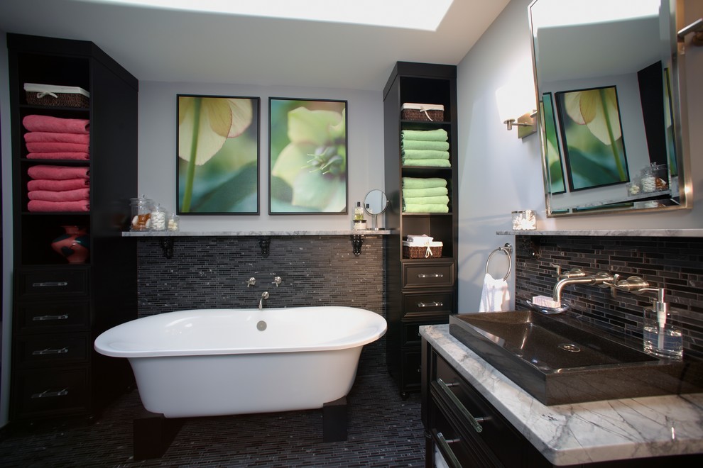 Inspiration for a contemporary bathroom in Calgary with a vessel sink and a freestanding tub.