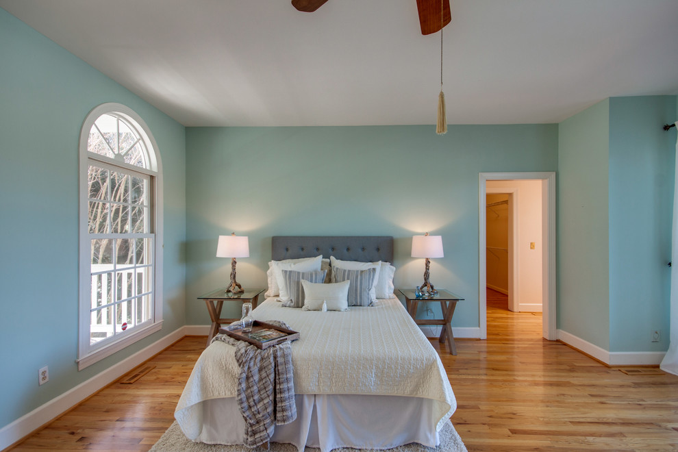 Inspiration for a traditional bedroom in Charleston with green walls and medium hardwood floors.