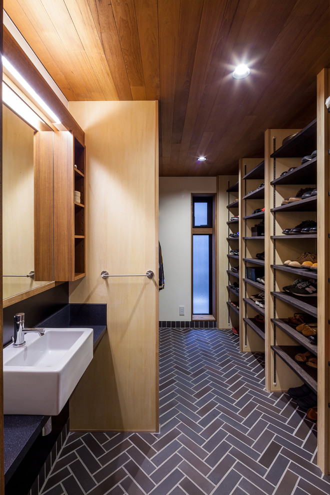 Inspiration for a contemporary storage and wardrobe in Osaka with open cabinets and brown floor.