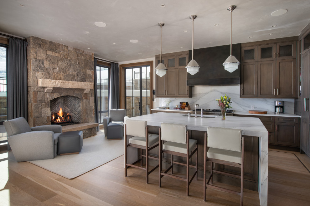 Elegant kitchen photo in Denver with marble countertops and marble backsplash