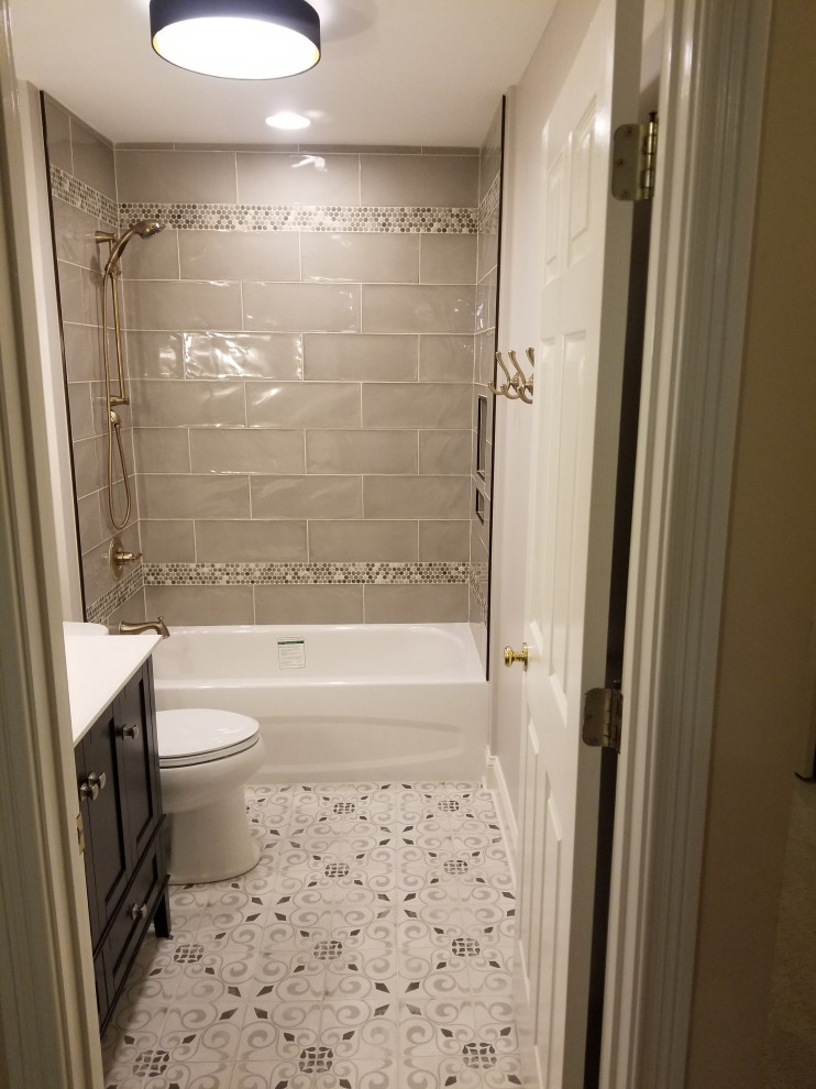 Inspiration for a transitional kids' gray tile and ceramic tile porcelain tile and single-sink alcove bathtub remodel with gray walls