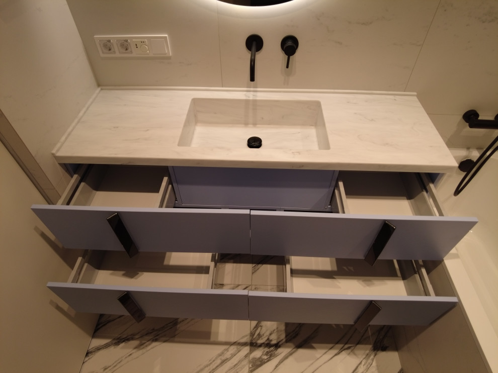 Inspiration for a medium sized contemporary ensuite bathroom in Moscow with freestanding cabinets, a submerged bath, black and white tiles, solid surface worktops, grey worktops, a single sink and a freestanding vanity unit.