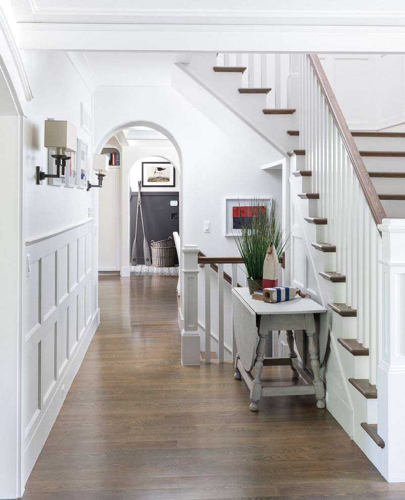 Mid-sized beach style foyer in Detroit with white walls and medium hardwood floors.