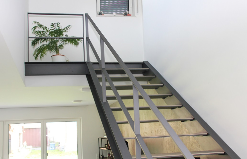 Design ideas for a large contemporary tiled straight metal railing staircase in Other.