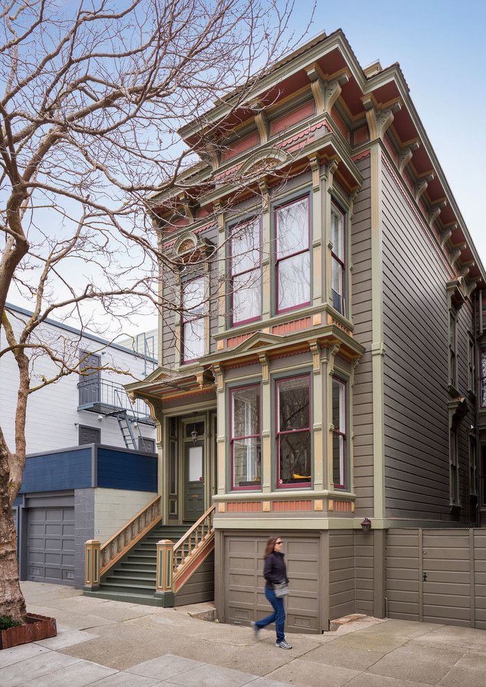Design ideas for a traditional two-storey brown house exterior in San Francisco with wood siding and a flat roof.