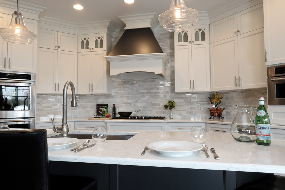 Large transitional u-shaped dark wood floor open concept kitchen photo in Cincinnati with a single-bowl sink, flat-panel cabinets, white cabinets, granite countertops, gray backsplash, subway tile backsplash, paneled appliances and an island