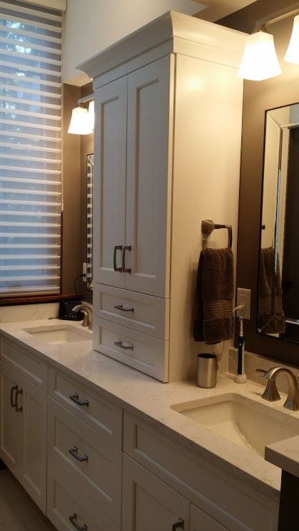 Inspiration for a large transitional master gray tile and ceramic tile porcelain tile and white floor bathroom remodel with flat-panel cabinets, white cabinets, a one-piece toilet, an undermount sink, quartz countertops and a hinged shower door
