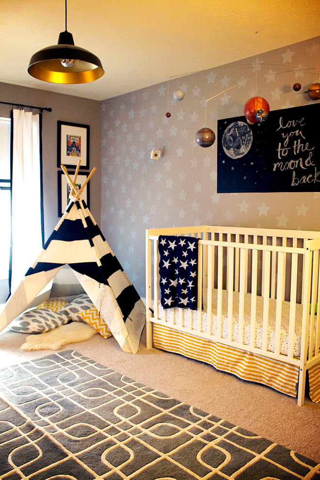 This is an example of a mid-sized eclectic nursery for boys in Indianapolis with grey walls and carpet.