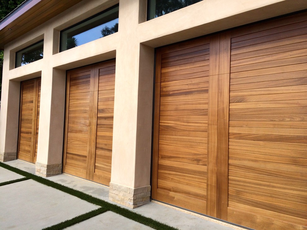 Inspiration for a large tropical attached three-car carport remodel in Orange County
