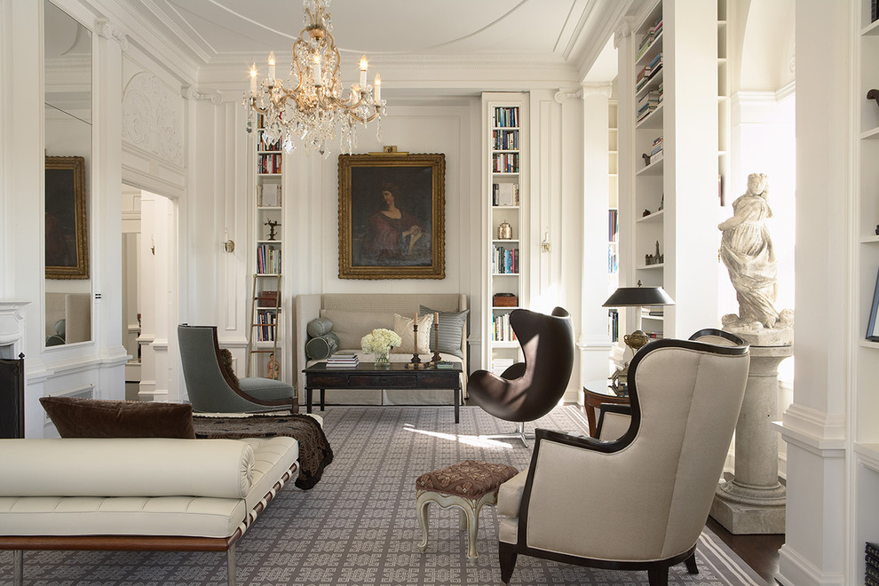 Inspiration for a large traditional enclosed living room in New York with a library, white walls, no tv, dark hardwood floors and a standard fireplace.